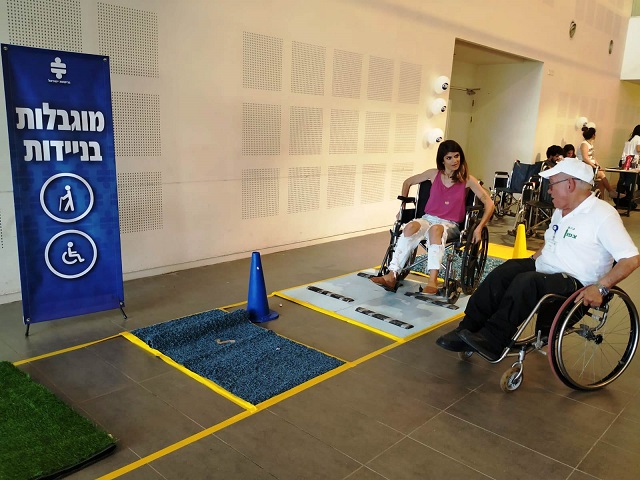 Students going through an obstacle course while riding a wheelchair