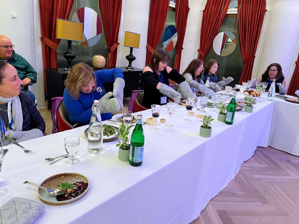 Participants experience eating with gloves that simulate physical limitations